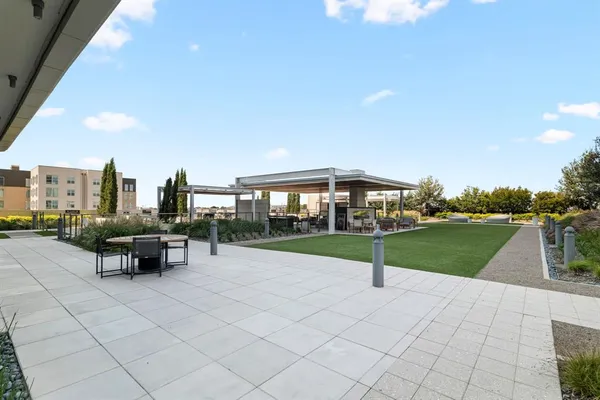a view of a patio with a yard