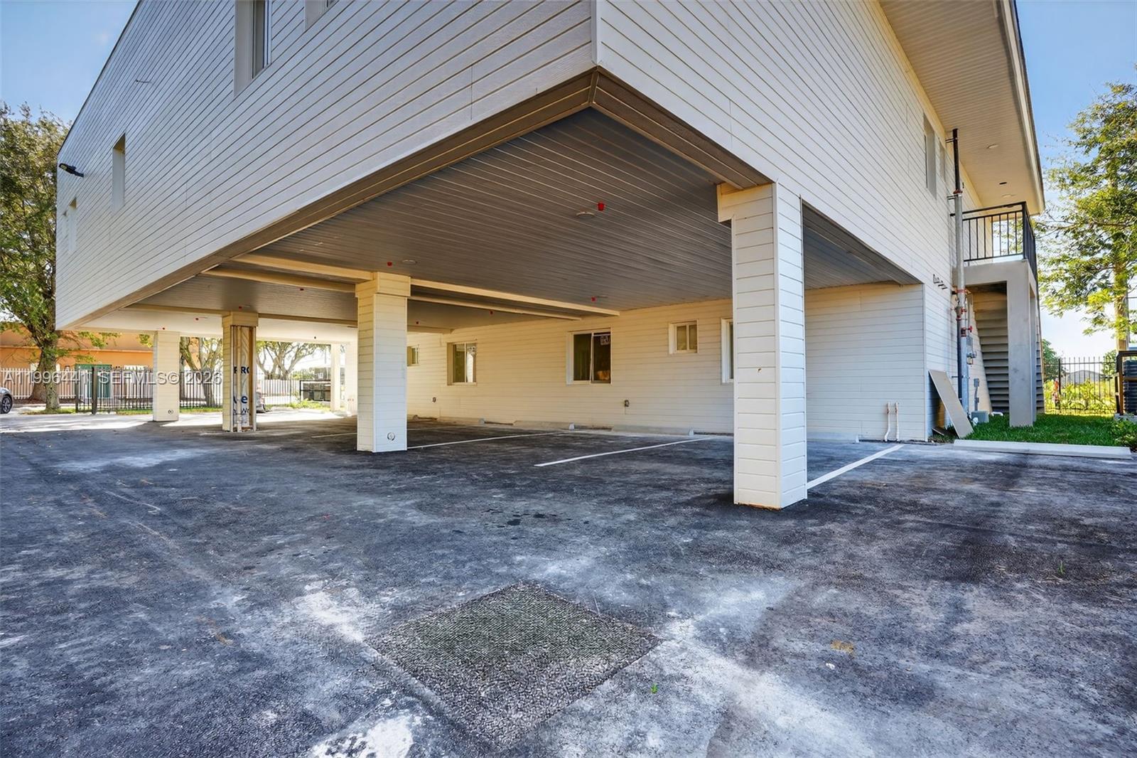 1515 Redland Road, Unit 1 Florida City, FL 33034 - Photo 11 of 13 a view of a house with a yard and garage