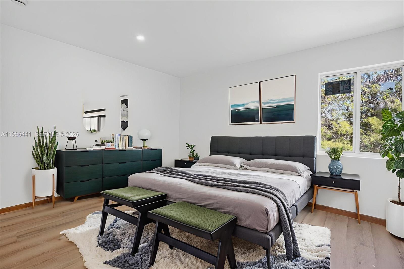 1515 Redland Road, Unit 1 Florida City, FL 33034 - Photo 7 of 13 a bedroom with a bed and a table in it