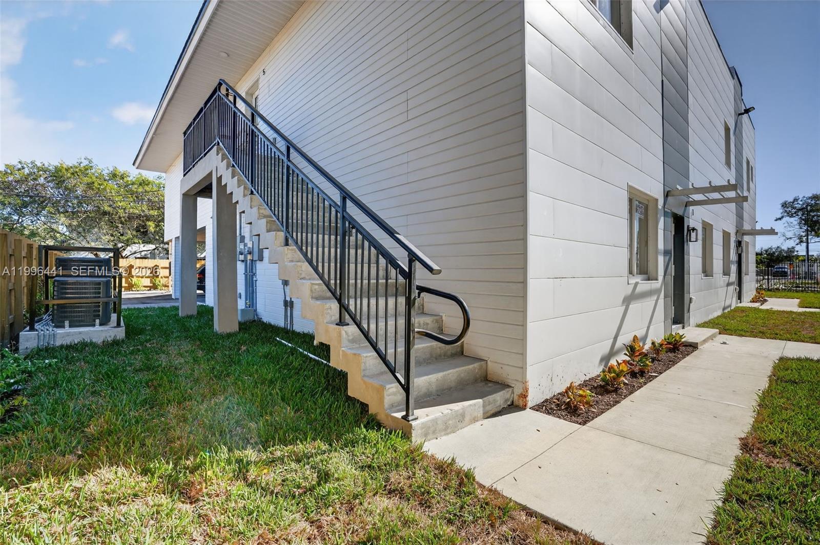 1515 Redland Road, Unit 1 Florida City, FL 33034 - Photo 9 of 13 a view of a house with a yard