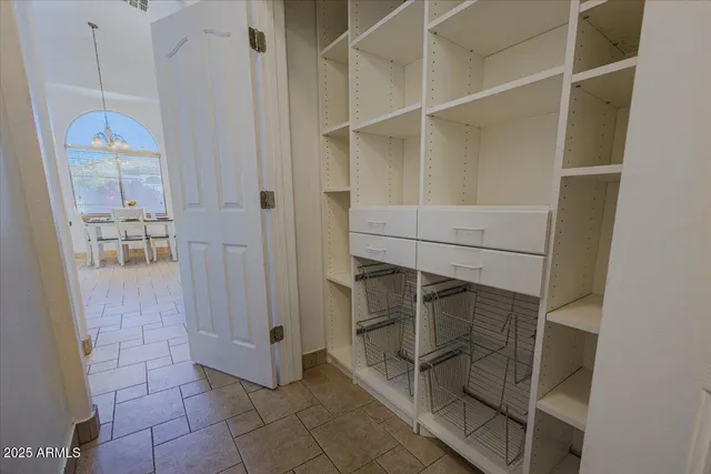 a bathroom with a shower and closet