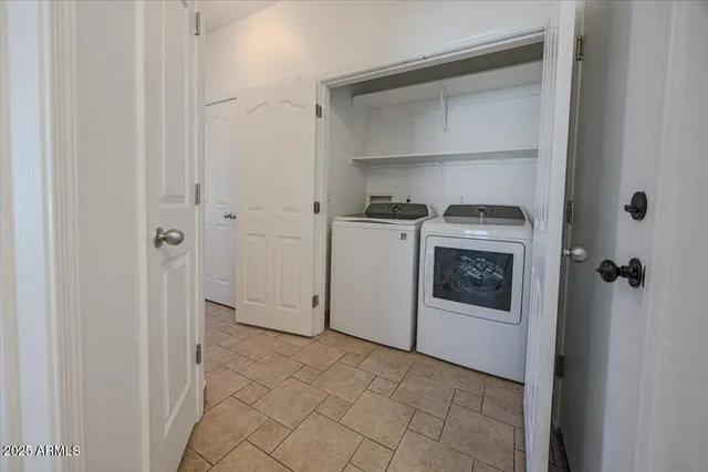 a utility room with washer and dryer