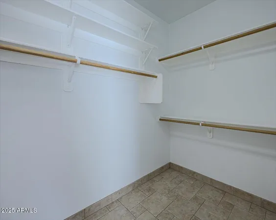a view of an empty walk in closet
