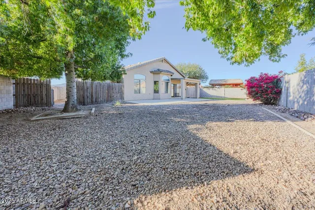 a house that has a tree in front of it