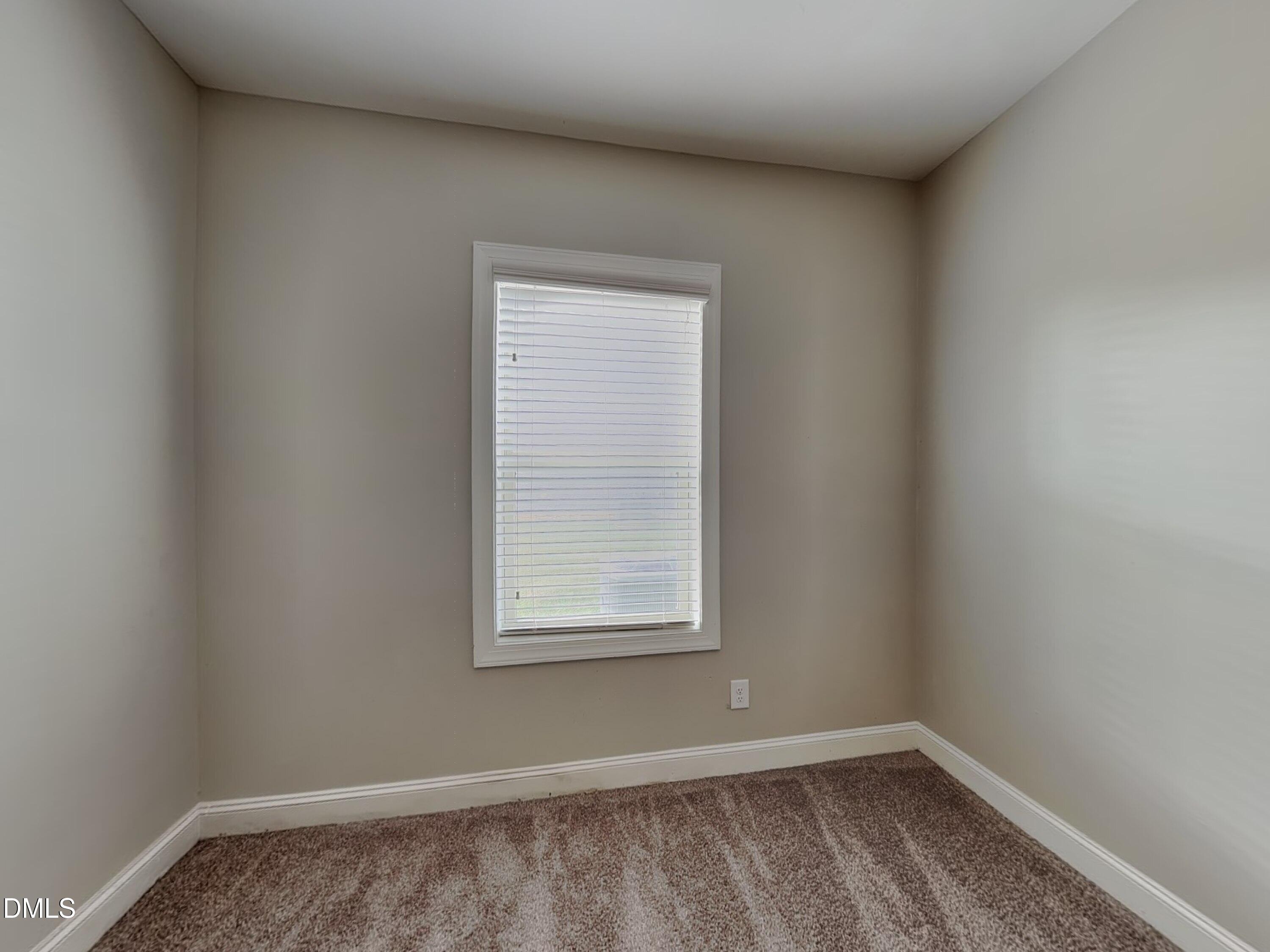 70 Leaf Spring Way Youngsville, NC 27596 - Photo 13 of 16 a view of an empty room with a window