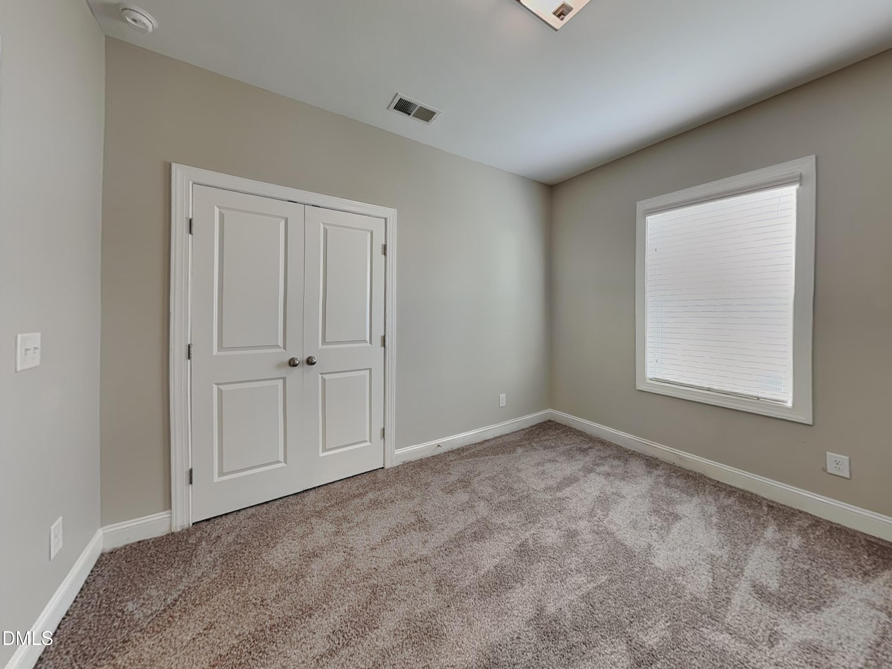 70 Leaf Spring Way Youngsville, NC 27596 - Photo 14 of 16 a view of an empty room with a window
