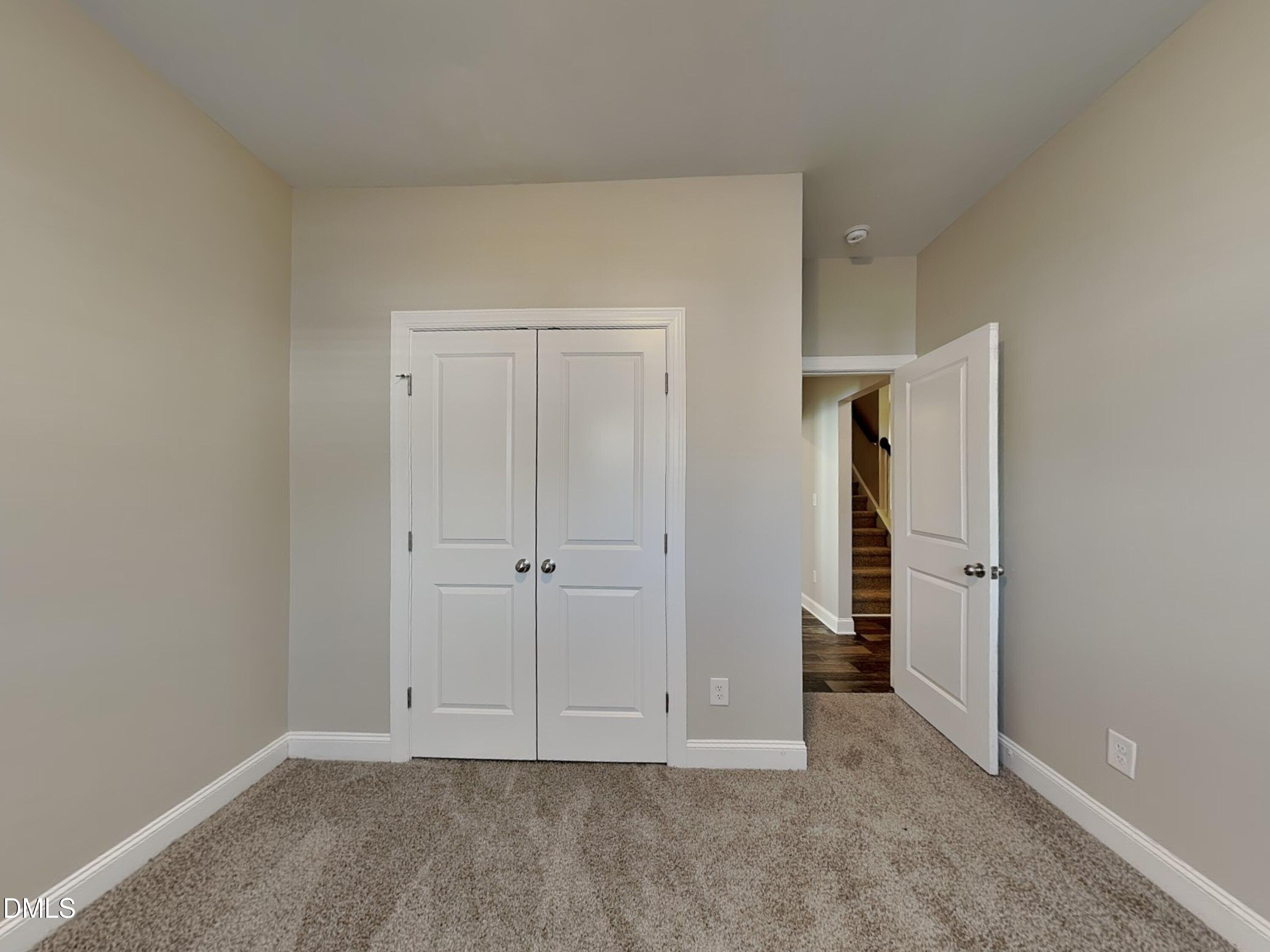 70 Leaf Spring Way Youngsville, NC 27596 - Photo 9 of 16 an empty room with a hallway