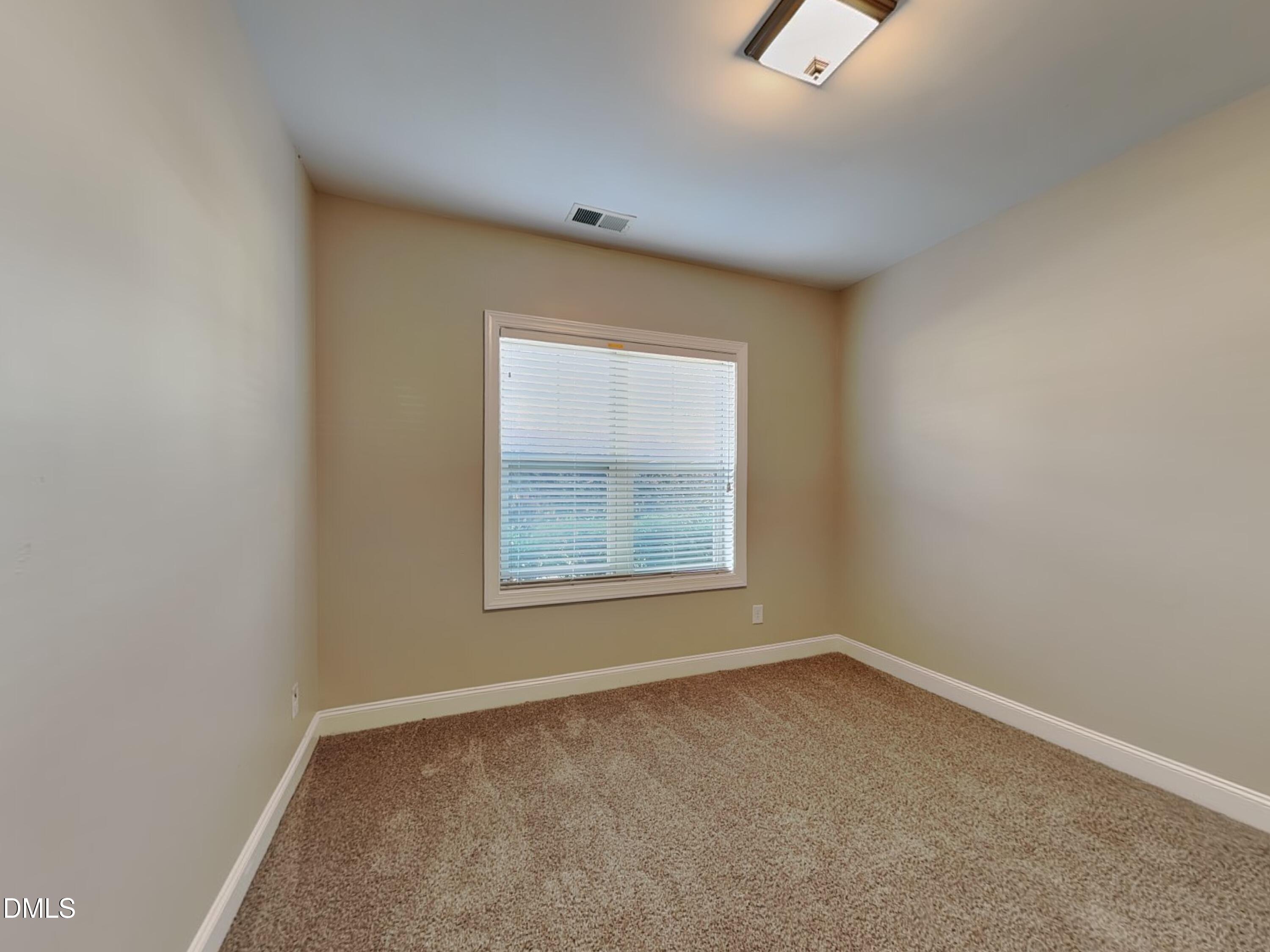 70 Leaf Spring Way Youngsville, NC 27596 - Photo 10 of 16 an empty room with a window