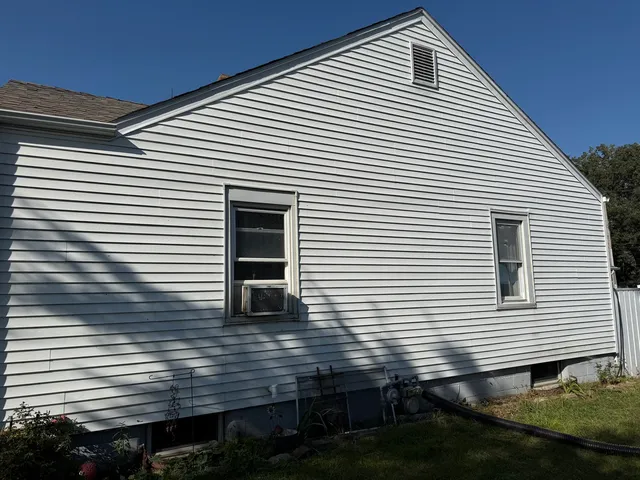 a view of a house with wooden deck