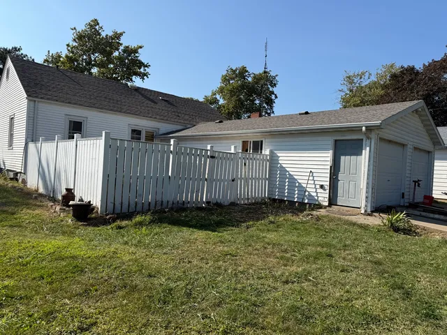 a view of a backyard of the house