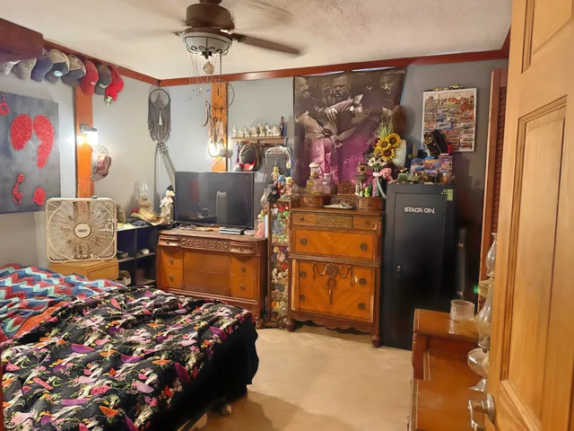 a bedroom with bed and window