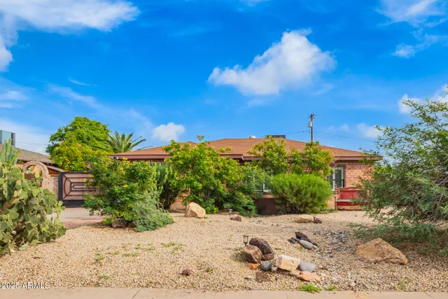 a view of a house with a street