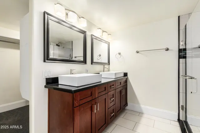 a bathroom with a glass shower door