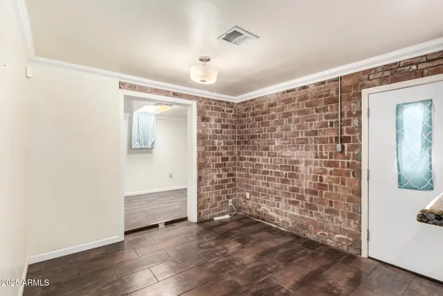 a kitchen with a refrigerator a sink and cabinets