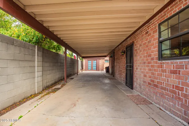 a view of a house with backyard porch and sitting area