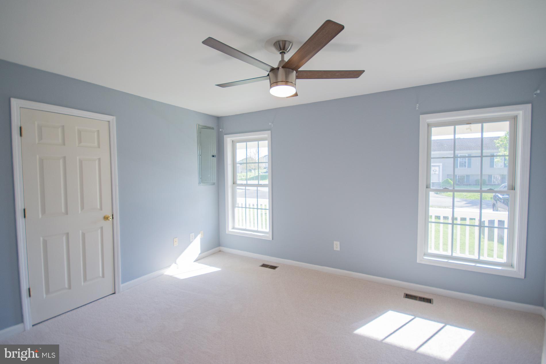 40 Stiles Way Ranson, WV 25438 - Photo 21 of 44 a view of empty room with wooden floor and fan