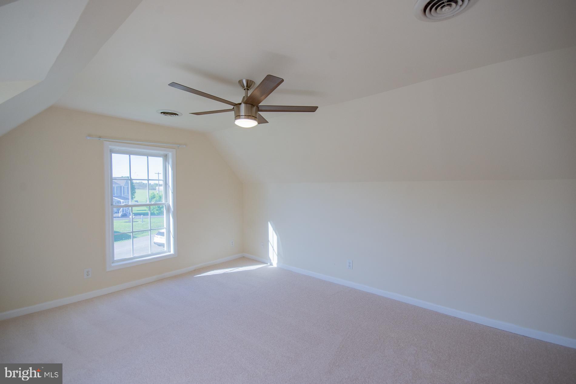 40 Stiles Way Ranson, WV 25438 - Photo 33 of 44 an empty room with a window and a fan