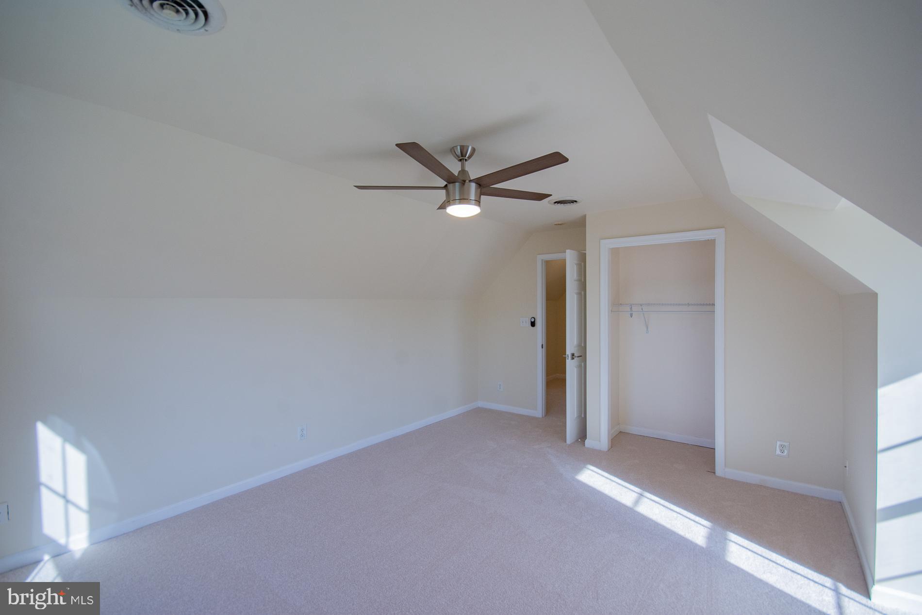 40 Stiles Way Ranson, WV 25438 - Photo 34 of 44 an empty room with a ceiling fan and window
