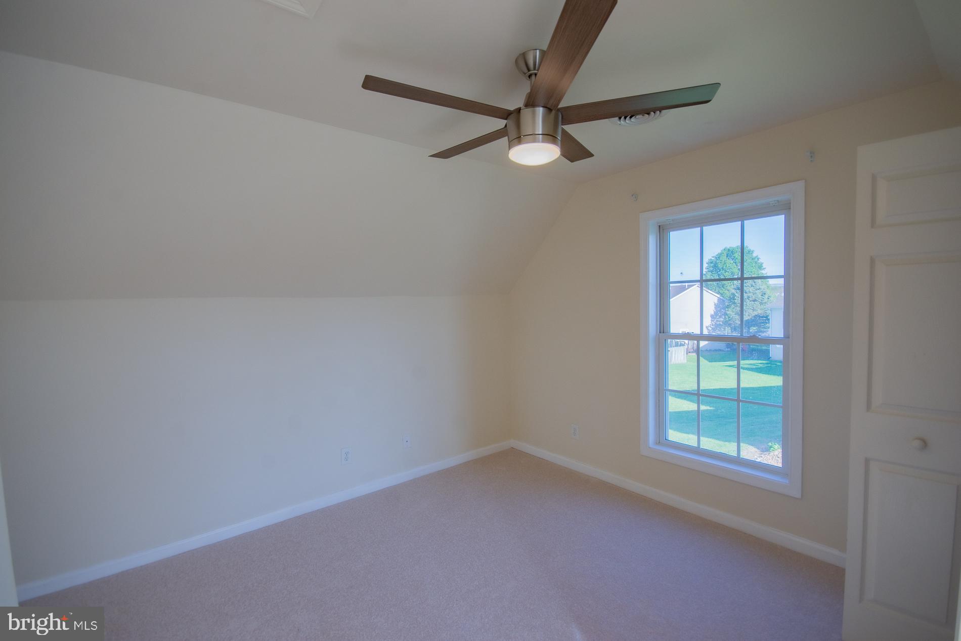 40 Stiles Way Ranson, WV 25438 - Photo 38 of 44 an empty room with a window and a fan