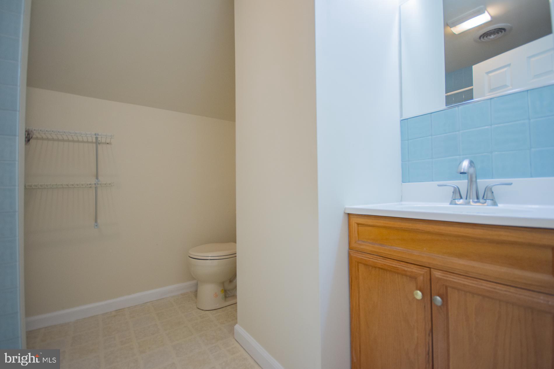 40 Stiles Way Ranson, WV 25438 - Photo 39 of 44 a bathroom with a toilet a sink and vanity