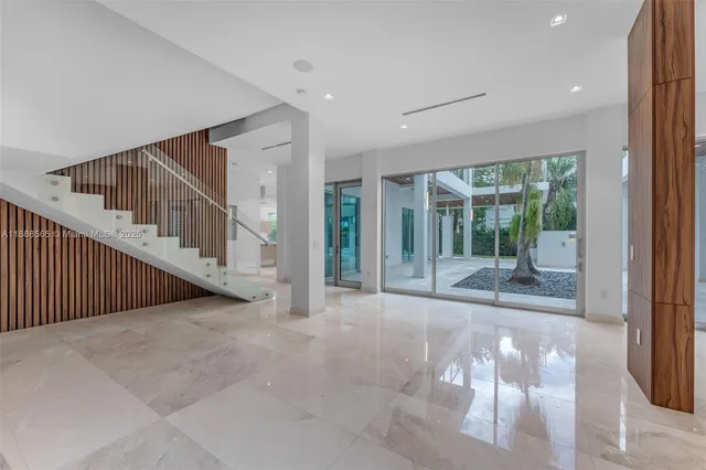 a kitchen with kitchen island a counter top space a sink and refrigerator