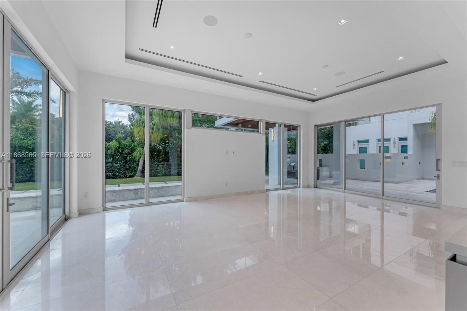 9101 Southwest 69th Court Pinecrest, FL 33156 - Photo 22 of 69 a view of an empty room with glass door