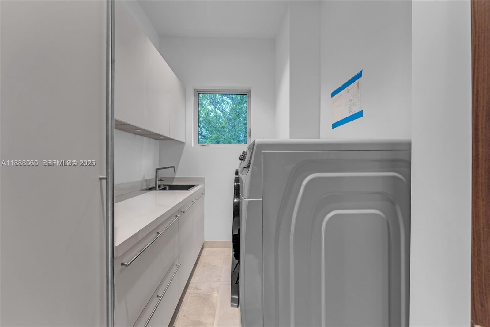 9101 Southwest 69th Court Pinecrest, FL 33156 - Photo 28 of 63 Second floor laundry room