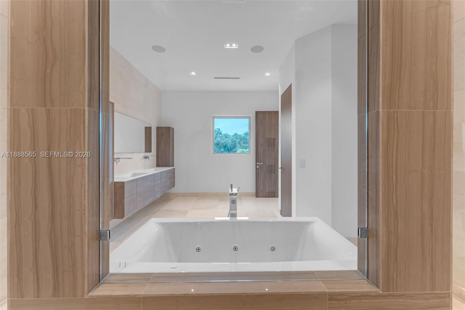 9101 Southwest 69th Court Pinecrest, FL 33156 - Photo 36 of 69 a bathroom with bathtub and shower