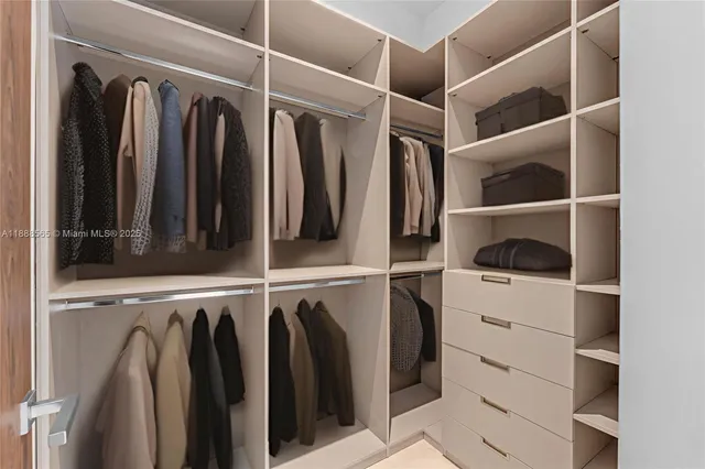 a bedroom with a bed and flat screen tv