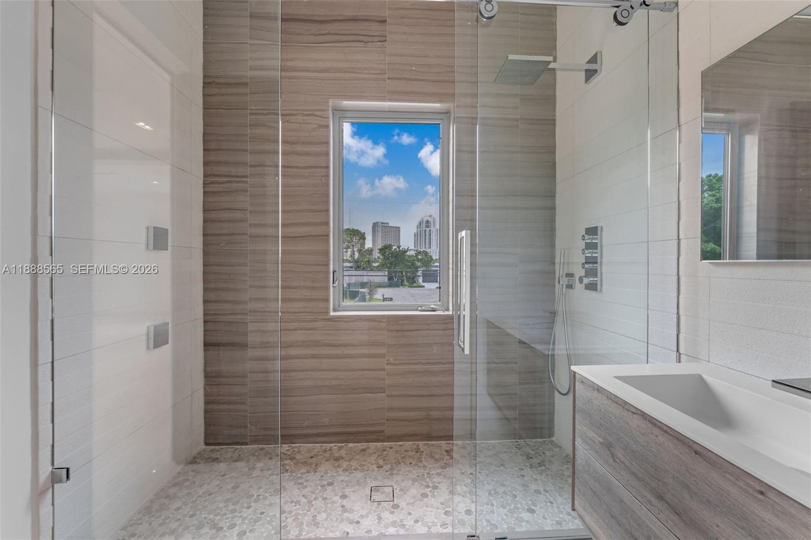 9101 Southwest 69th Court Pinecrest, FL 33156 - Photo 61 of 69 a bathroom with a bathtub and shower