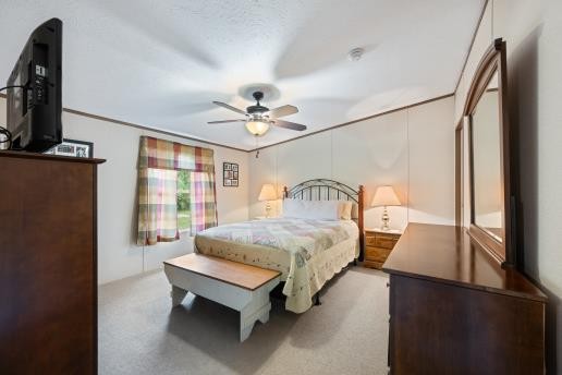 7112 Cobb Road Christiana, TN 37037 - Photo 11 of 22 a bedroom with a bed and a flat tv screen on dresser