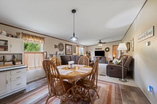 7112 Cobb Road Christiana, TN 37037 - Photo 6 of 22 a view of a dining room with furniture window and wooden floor