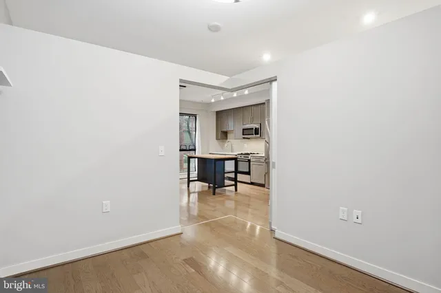 a view of a room with chairs and closet