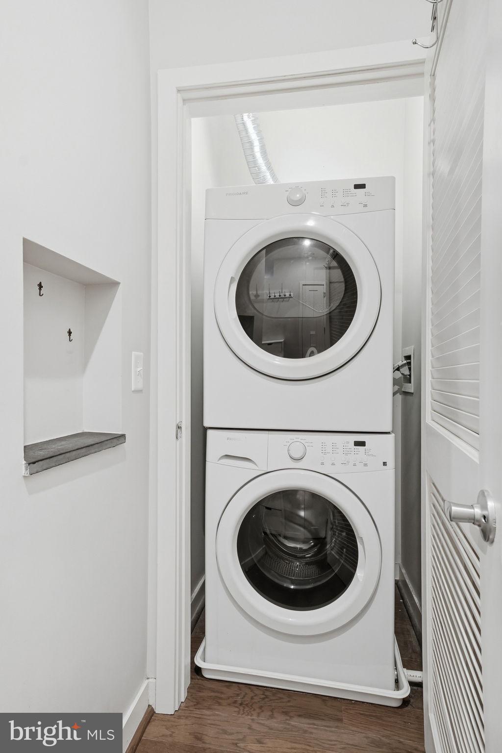 1320 Fenwick Lane, Unit 210 Silver Spring, MD 20910 - Photo 15 of 29 a utility room with dryer and washer