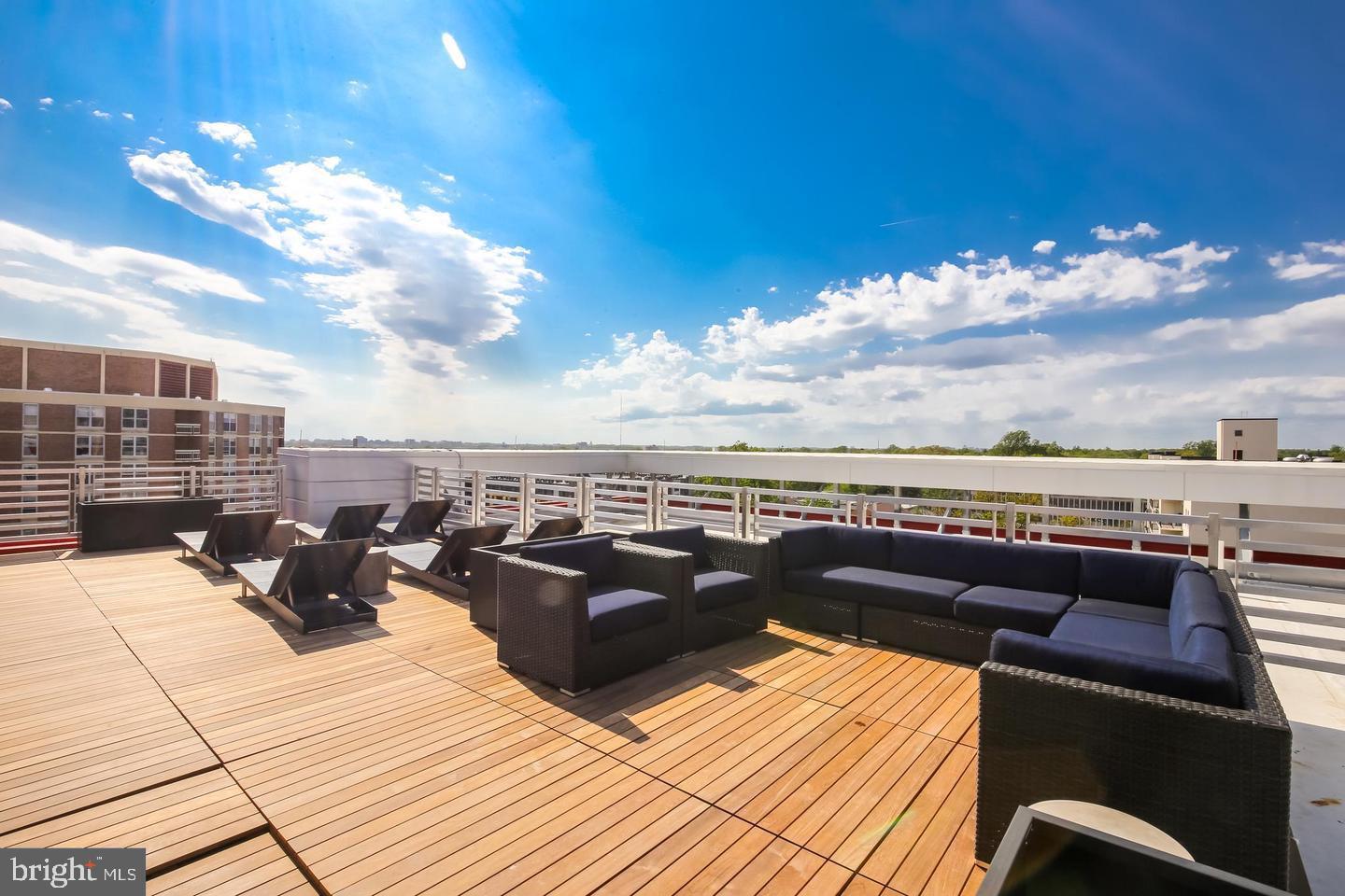 1320 Fenwick Lane, Unit 210 Silver Spring, MD 20910 - Photo 21 of 29 a view of roof deck with seating space and ocean view