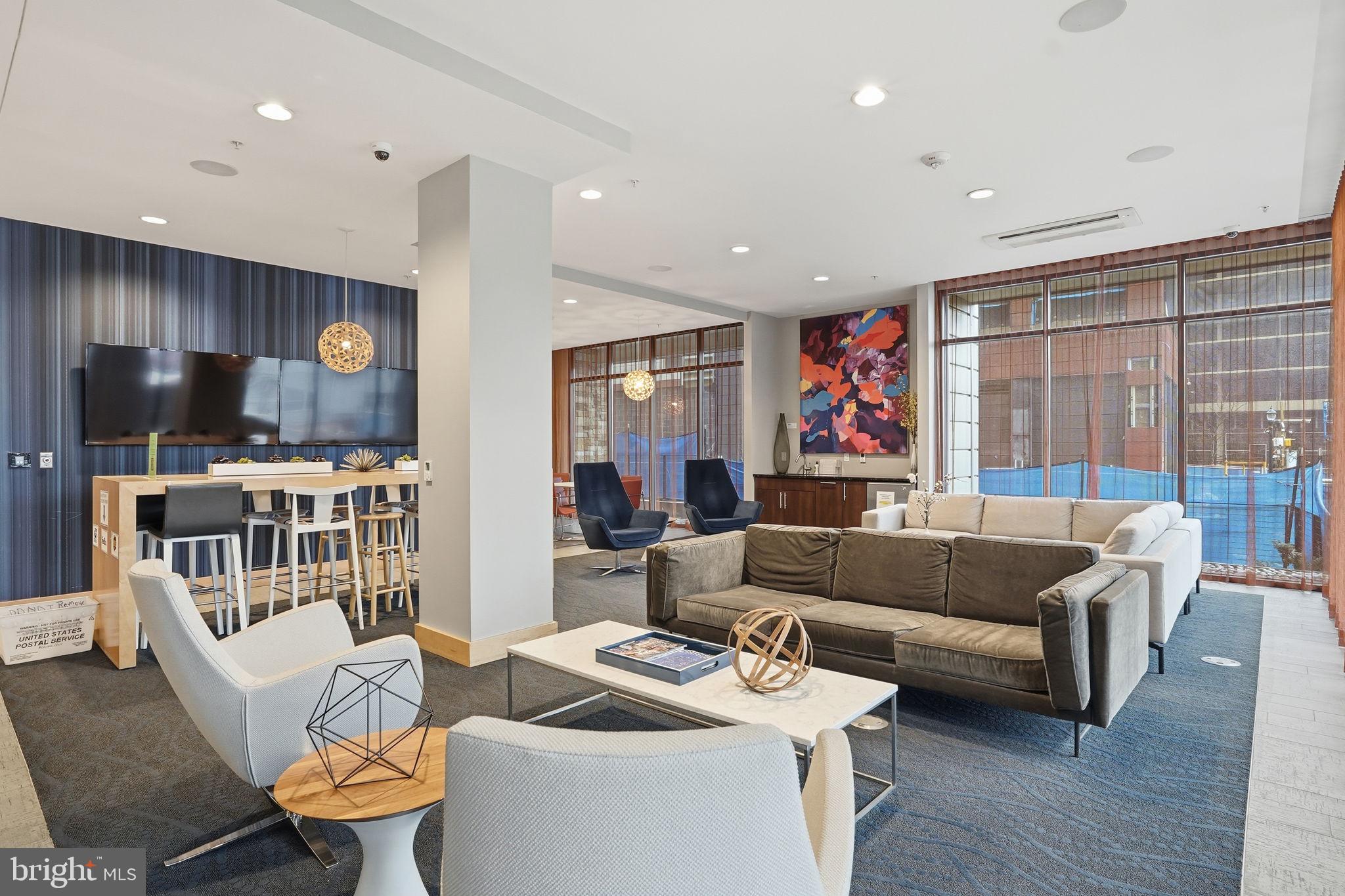 1320 Fenwick Lane, Unit 210 Silver Spring, MD 20910 - Photo 22 of 29 a living room with furniture and a flat screen tv