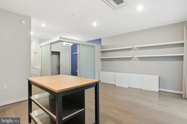 a kitchen with a table and chairs