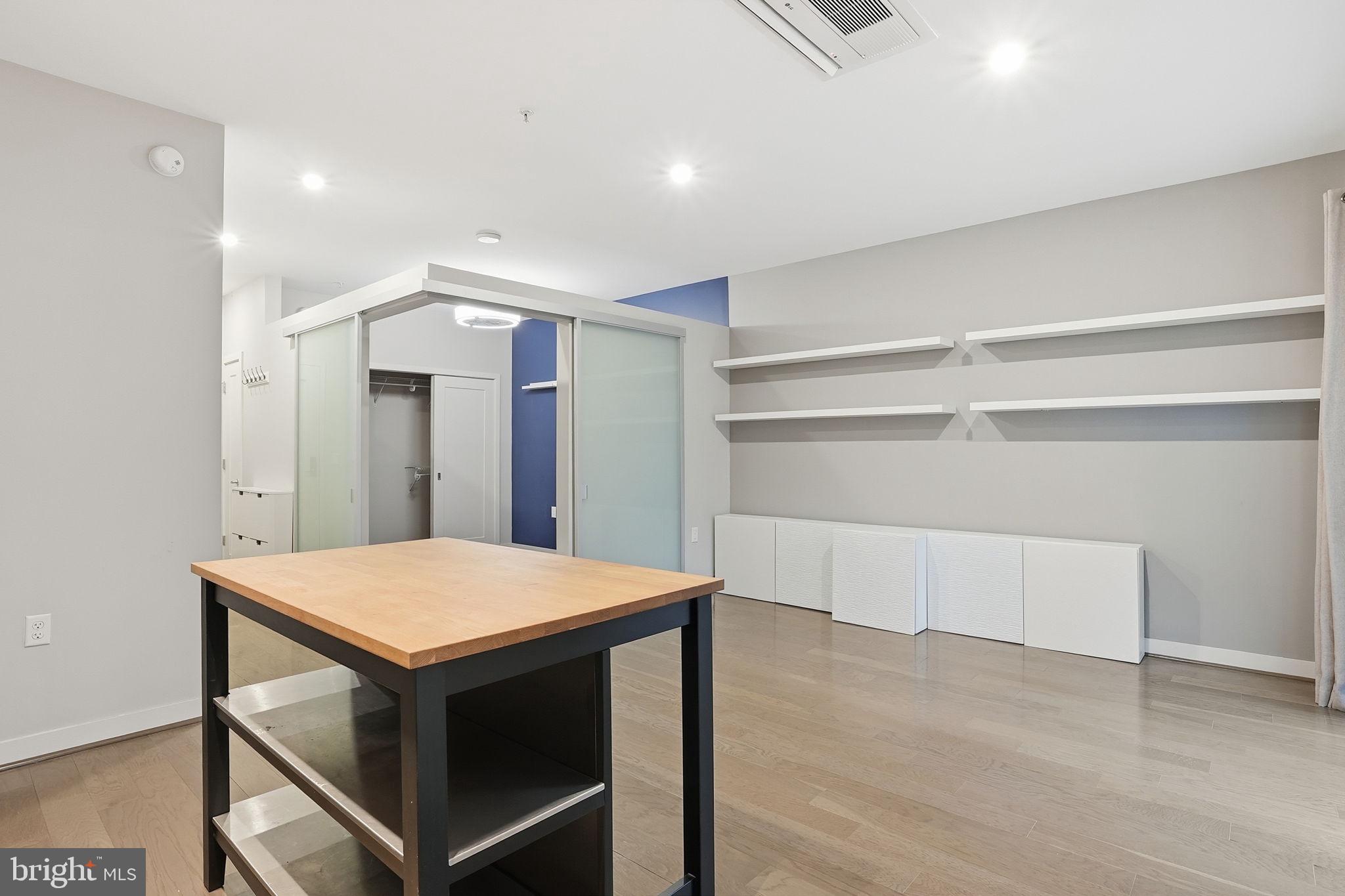 1320 Fenwick Lane, Unit 210 Silver Spring, MD 20910 - Photo 6 of 29 a kitchen with a table and chairs