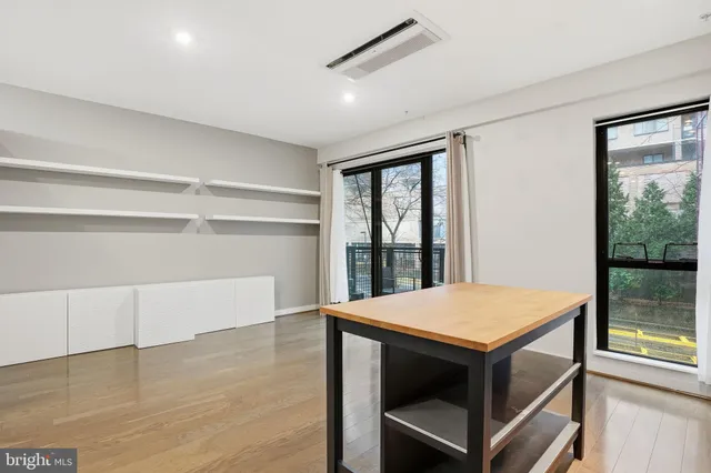 a view of an empty room with a window