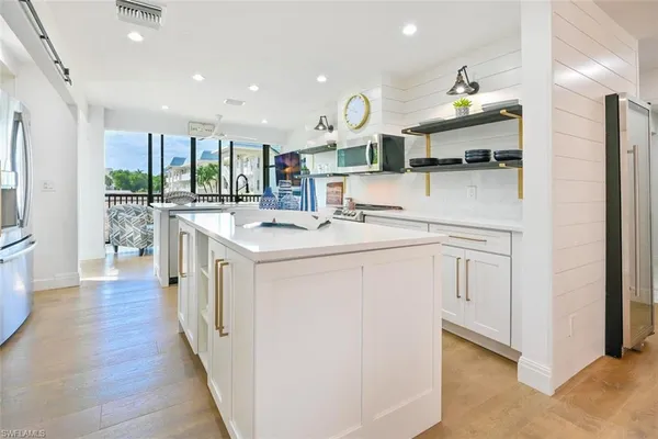 a kitchen with a table and chairs in it