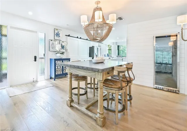 a kitchen with a stove cabinets and wooden floor