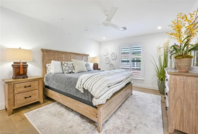 a bedroom with a large bed and a window