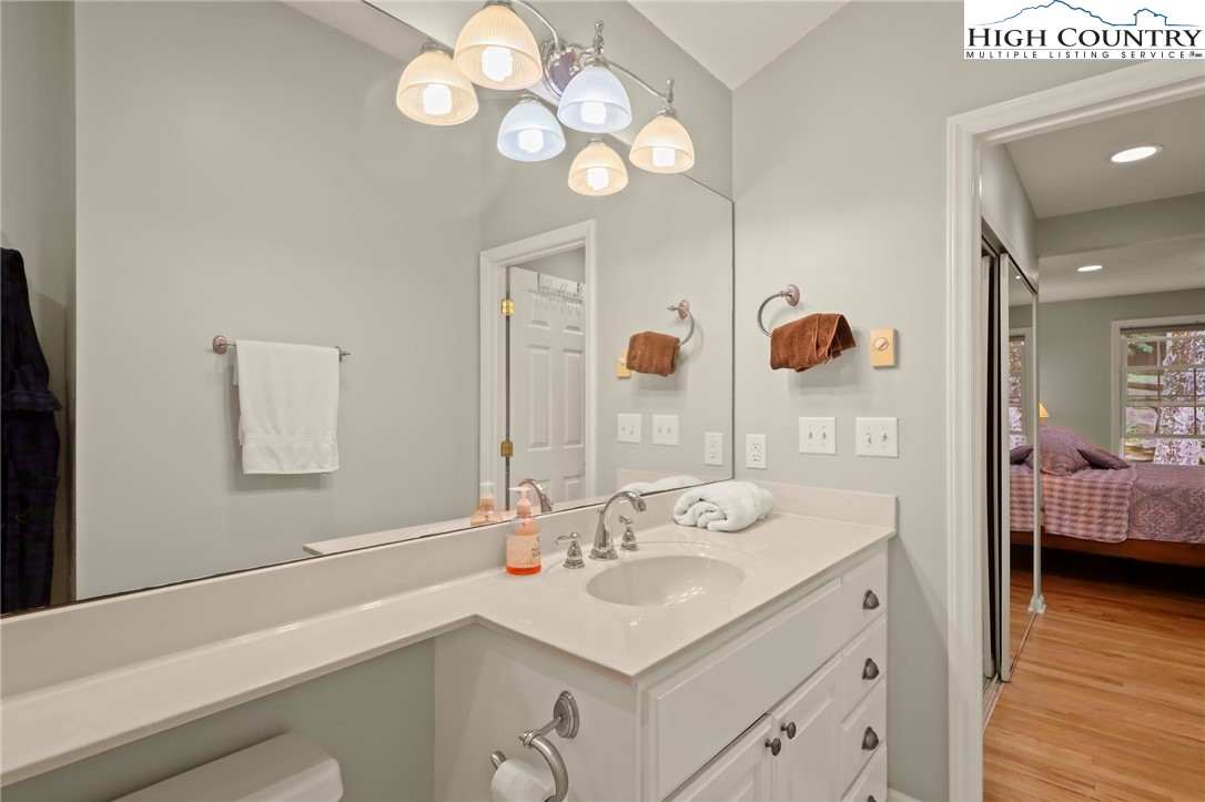 920-918 Pine Ridge Road Beech Mountain, NC 28604 - Photo 23 of 39 a bathroom with a sink and a mirror