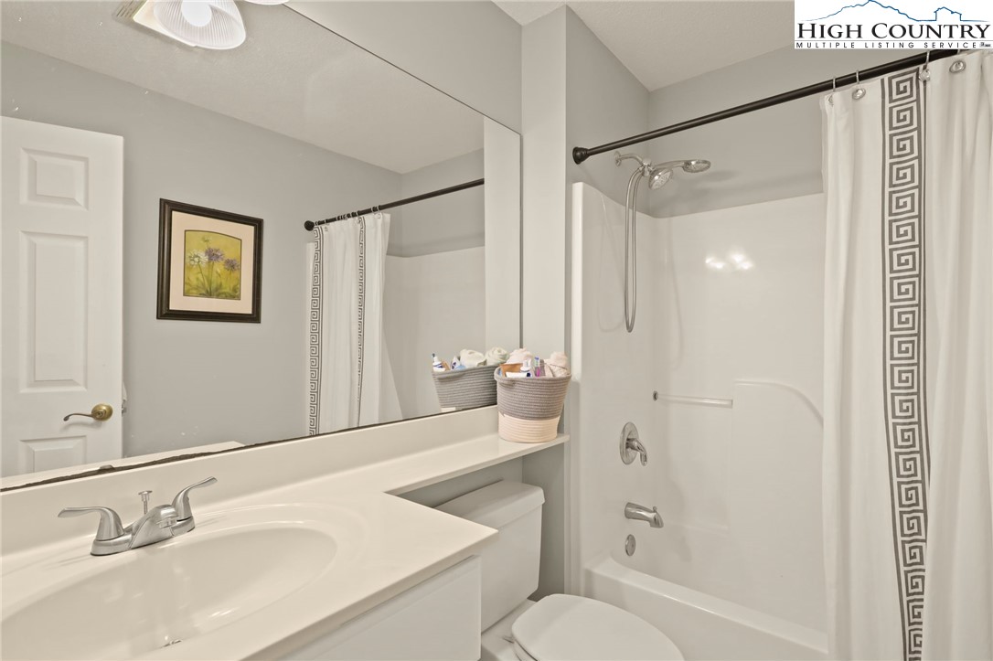 920-918 Pine Ridge Road Beech Mountain, NC 28604 - Photo 35 of 39 a bathroom with a sink toilet tub and shower