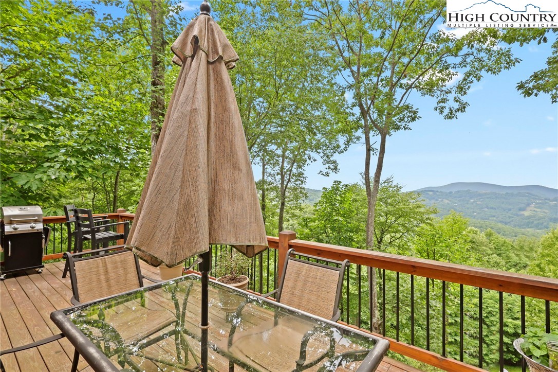 920-918 Pine Ridge Road Beech Mountain, NC 28604 - Photo 7 of 39 a view of a patio with a table and chairs