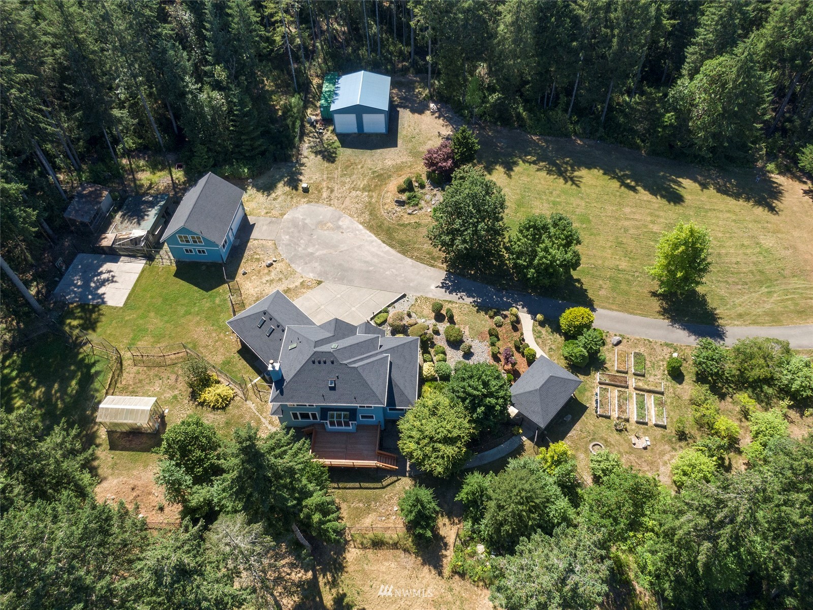 an aerial view of a house with outdoor space