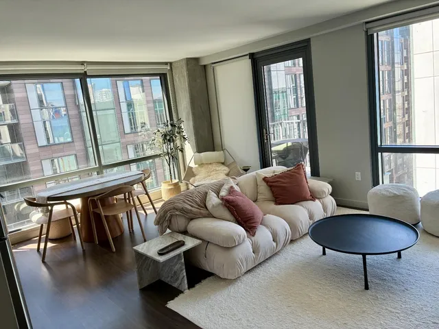 a living room with furniture and a window