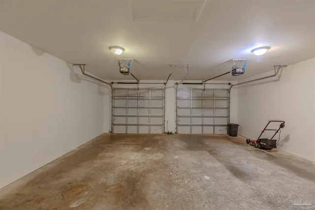 a view of a patio with table and chairs potted plants with large tree