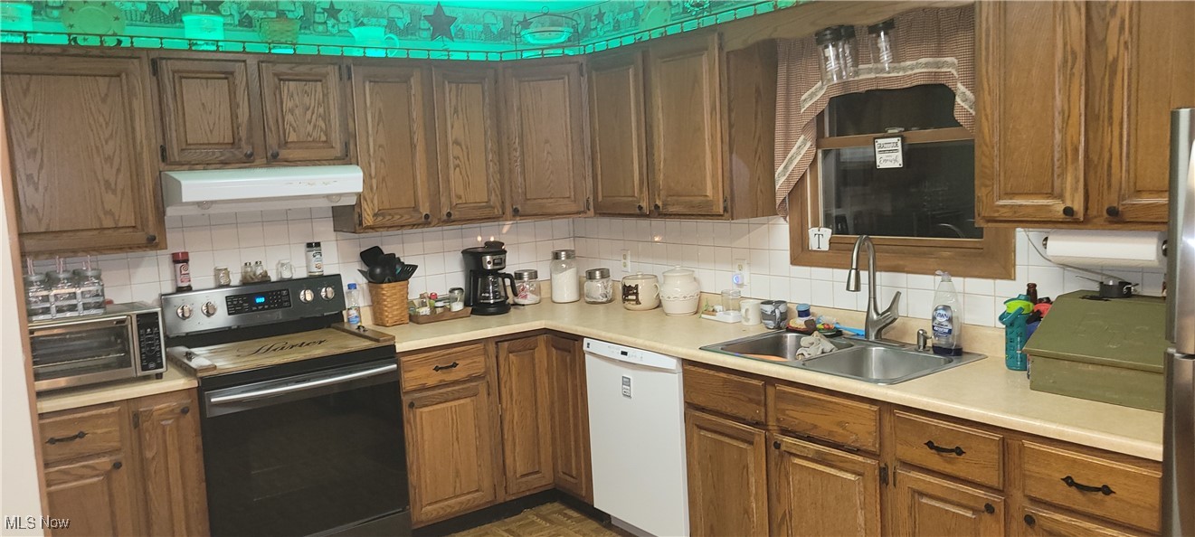 12980 Portie-Flamingo Road Corning, OH 43730 - Photo 5 of 30 Kitchen with tasteful backsplash, dishwasher, sink, and stainless steel electric stove