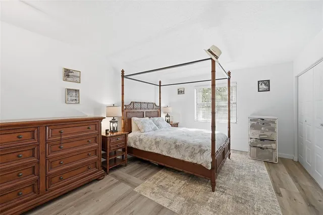 a bedroom with a bed and a dresser